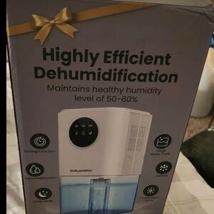 Compact White Dehumidifier with Blue Water Tank